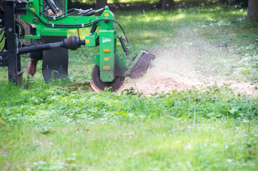 Stump grinding equipment removing a tree stump from a residential yard in Richfield, OH